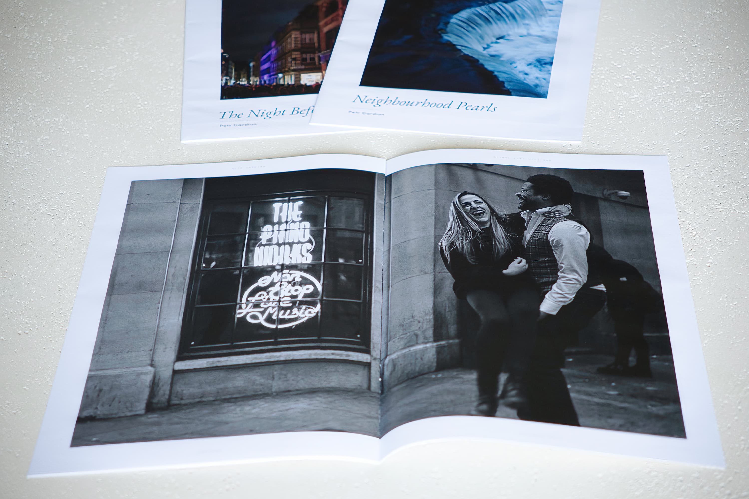 Turning a page of a OneZine photography zine